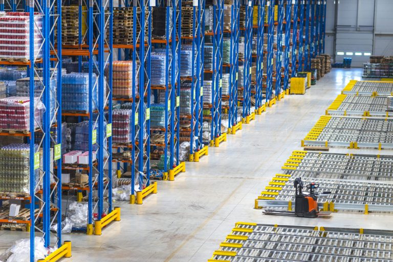 Shows both physical stock + digital system → perfect for Wholesale Inventory Management Software