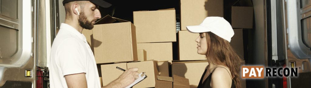 Boss and logistics checking parcel with carrier manifest