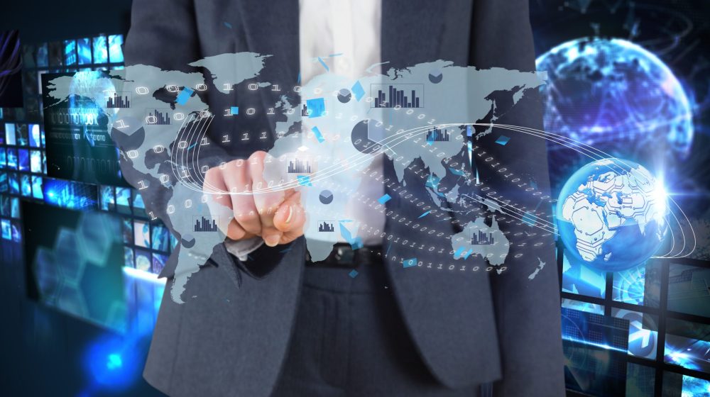 composite of businessman pointing at graphics